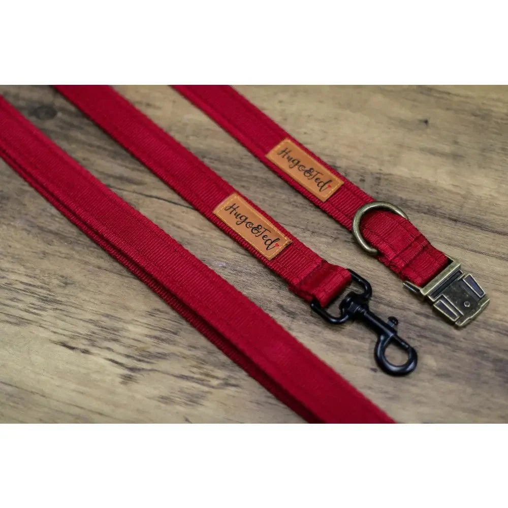 Burgundy Multi-Way Waterproof Dog Lead with matching collar on a wooden floor