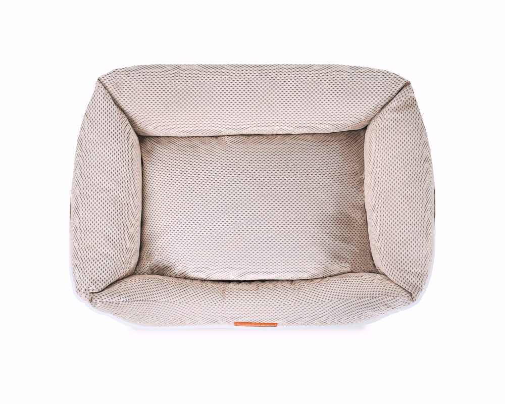 Top-down view of the Chatsworth beige bolster dog bed