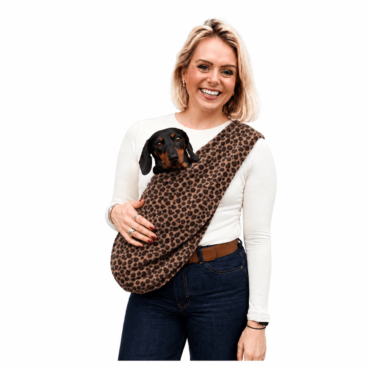 Woman carrying a dachshund in a leopard print Patterned Fleece Dog Sling