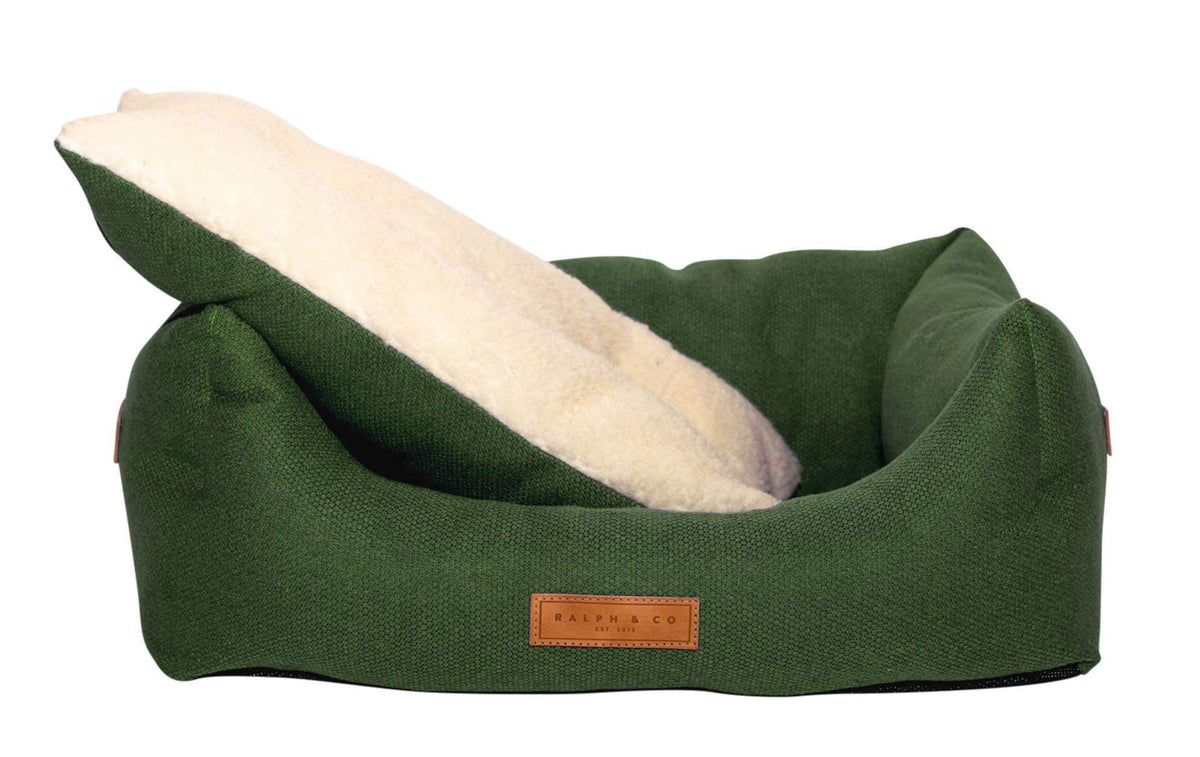 Richmond green bed with the cream sherpa cushion lifted out