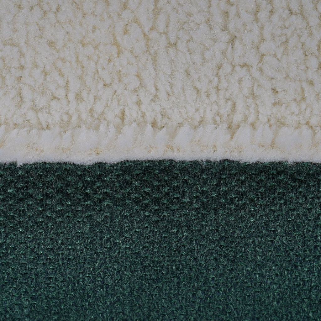 Close-up of the cream sherpa top and green woven fabric on the Richmond bed