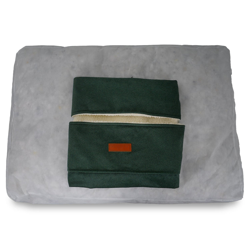 Removable green Richmond cover folded on top of the inner cushion