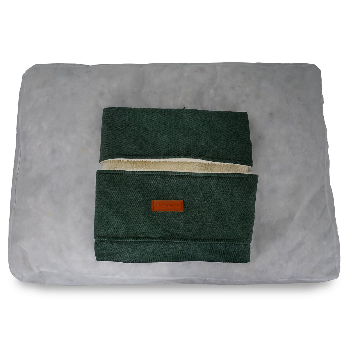 Removable green Richmond cover folded on top of the inner cushion